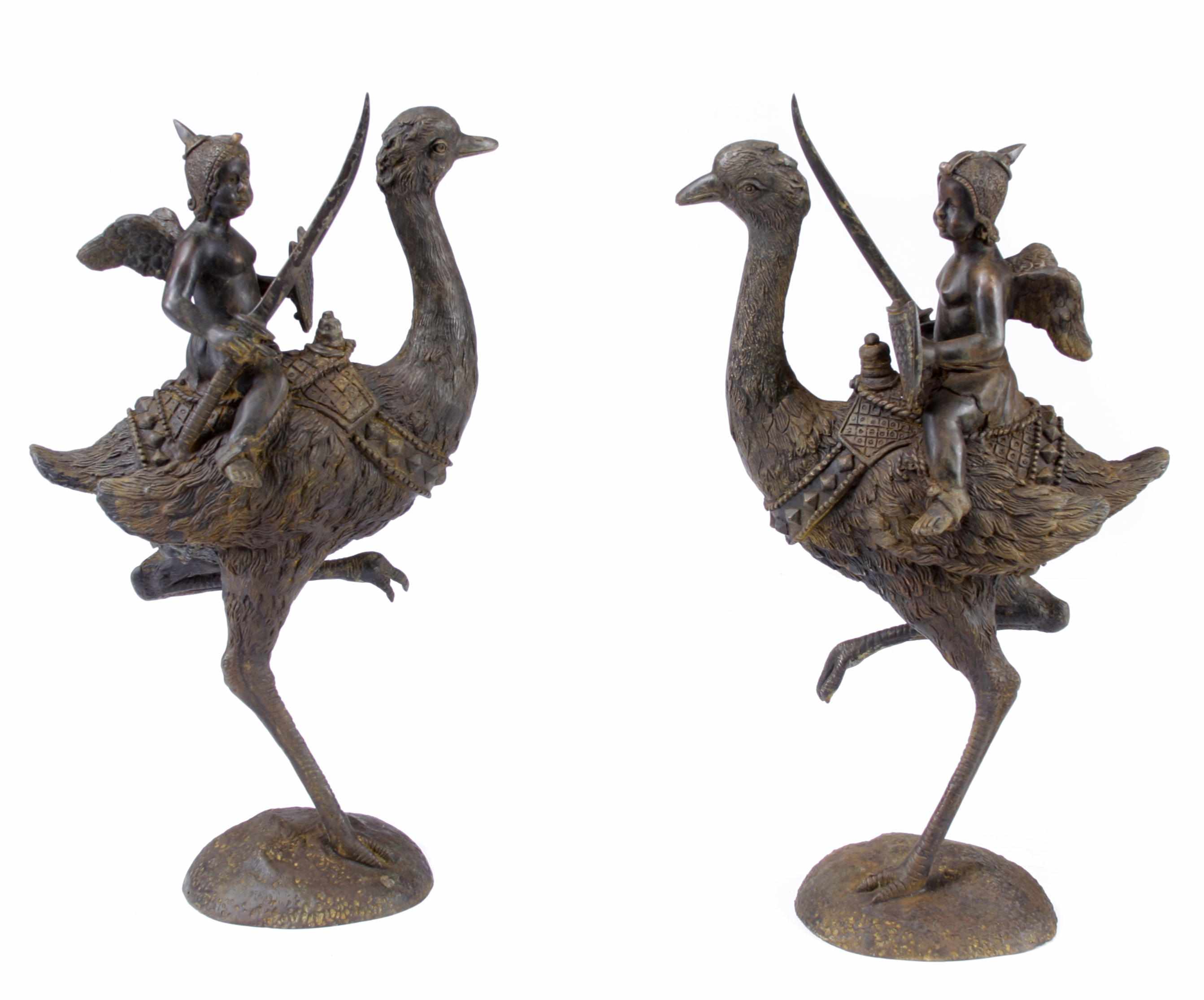 Appraisal: A pair of patinated bronze figural groups warriors and ostrichesheight