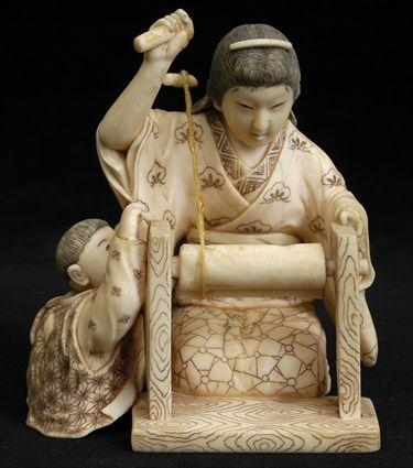 Appraisal: JAPANESE CARVED IVORY OKIMONO Carved as a kneeling woman at