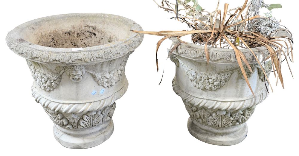 Appraisal: Pair of Concrete Urns having faces and wreaths signed Nina