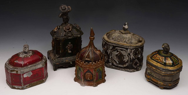 Appraisal: A lead sarcophagus shaped tobacco jar and coverdated and four