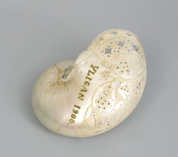 Appraisal: A Carved Nautilus Shell The nautilus shell is carved with