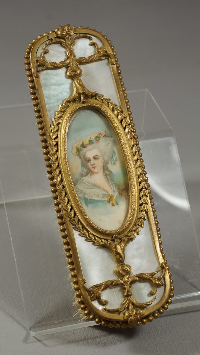 Appraisal: French gilt metal dresser brush the back set with portrait