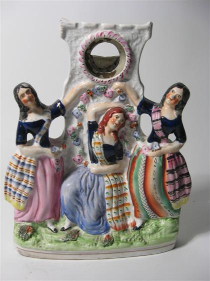 Appraisal: Staffordshire figural watch holder th century With three female figures