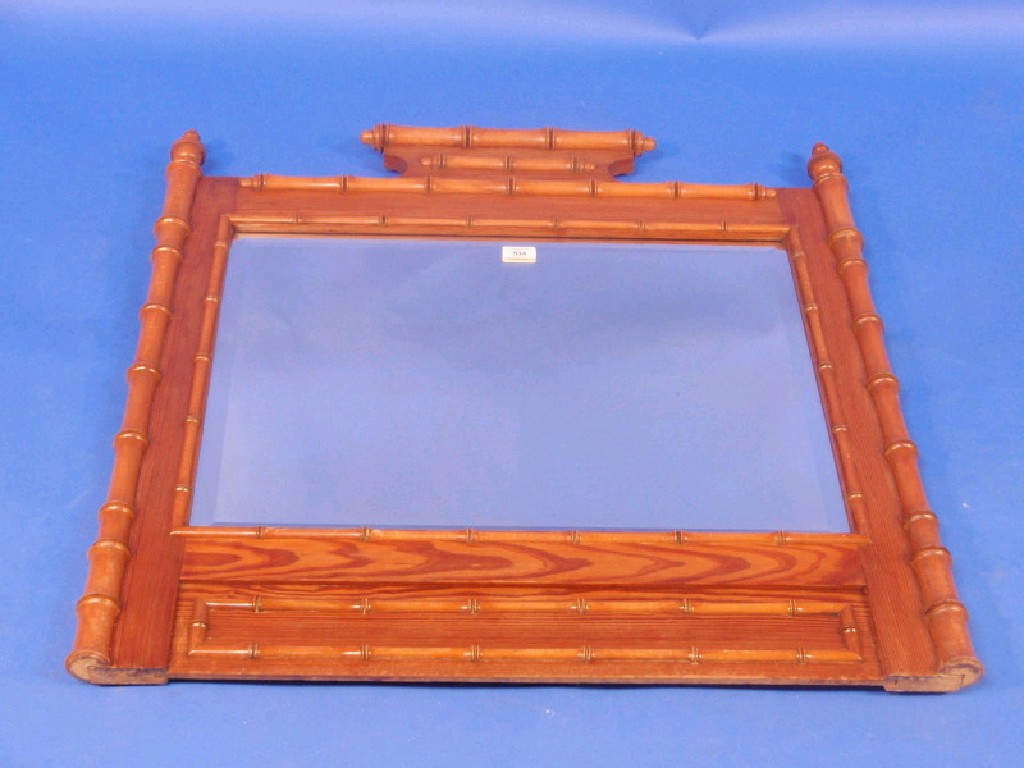 Appraisal: A Victorian pitch pine wall mirror with faux bamboo framing