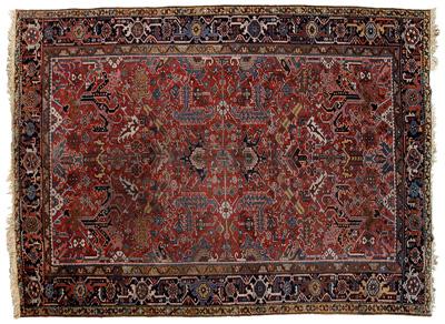 Appraisal: Heriz rug repeating floral and geometric designs on brick red