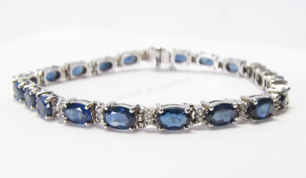 Appraisal: A K white gold line bracelet with twenty-one mm x