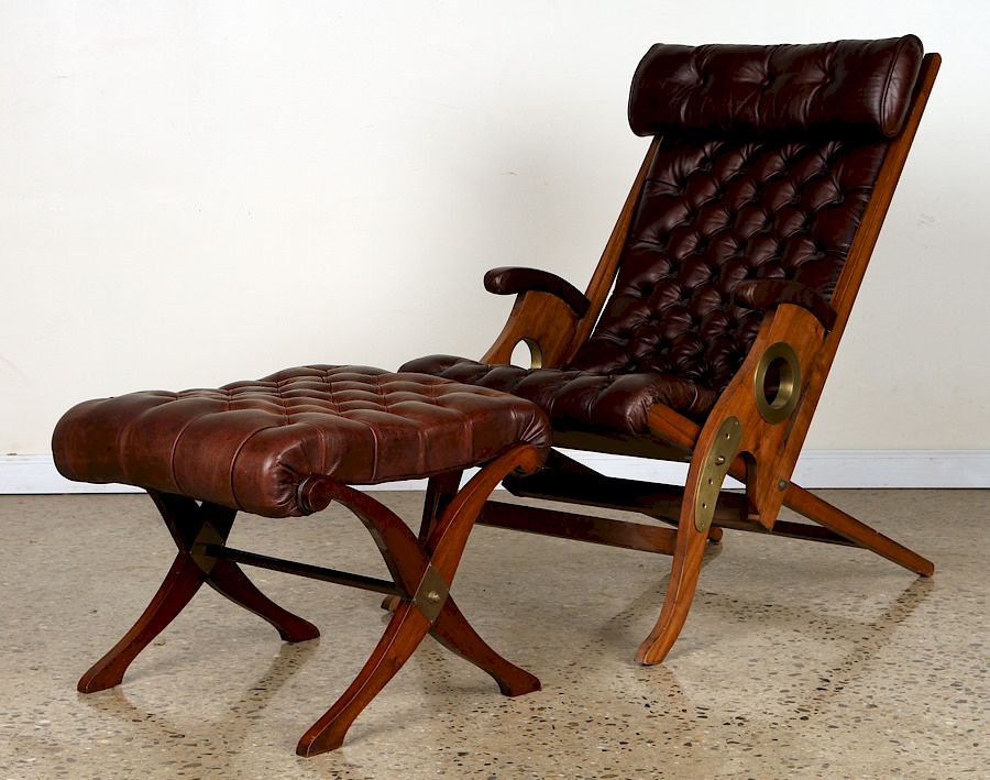 Appraisal: ADJUSTABLE LEATHER YACHT CHAIR AND STOOL C An adjustable walnut