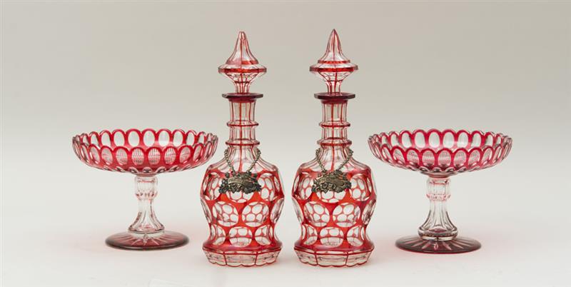 Appraisal: PAIR OF OVERLAY RUBY GLASS DECANTERS AND STOPPERS AND A