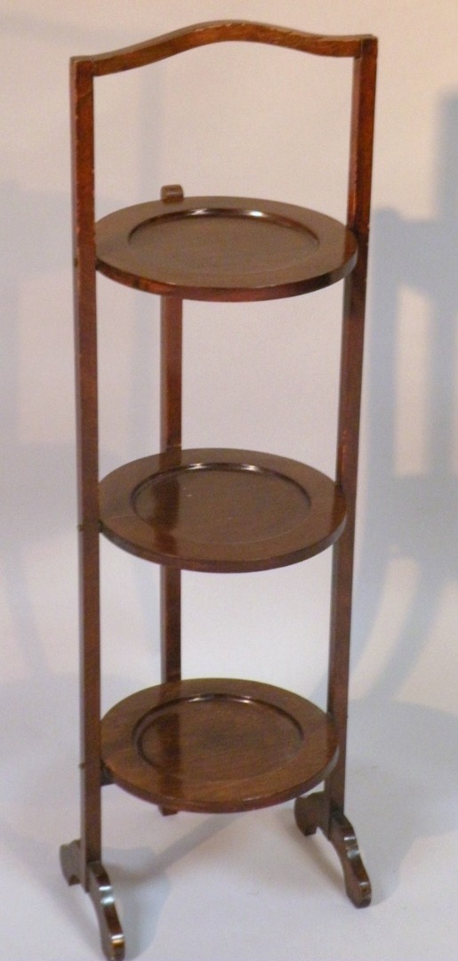 Appraisal: A mid- thC mahogany three tier cake stand the circular