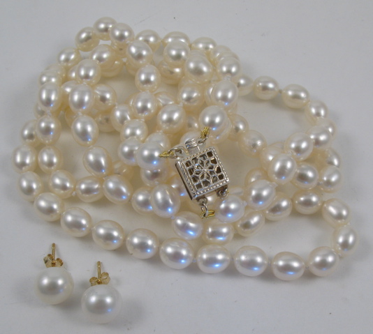 Appraisal: PEARL NECKLACE AND EARRINGS The double strand pearl necklace is