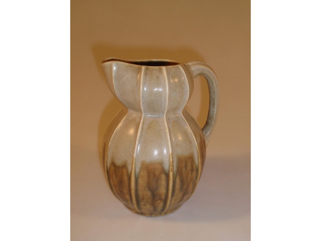 Appraisal: An early thC pottery jug of ribbed baluster form with