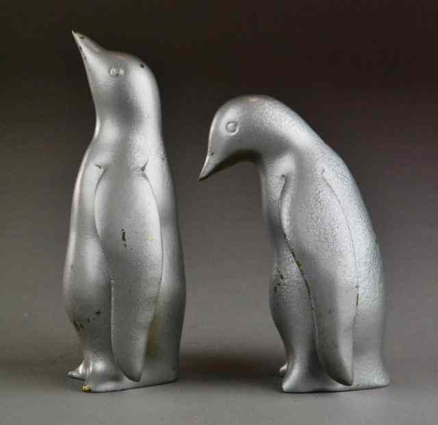 Appraisal: Art Deco Painted Brass PenguinsIncluding two brass penguins that have