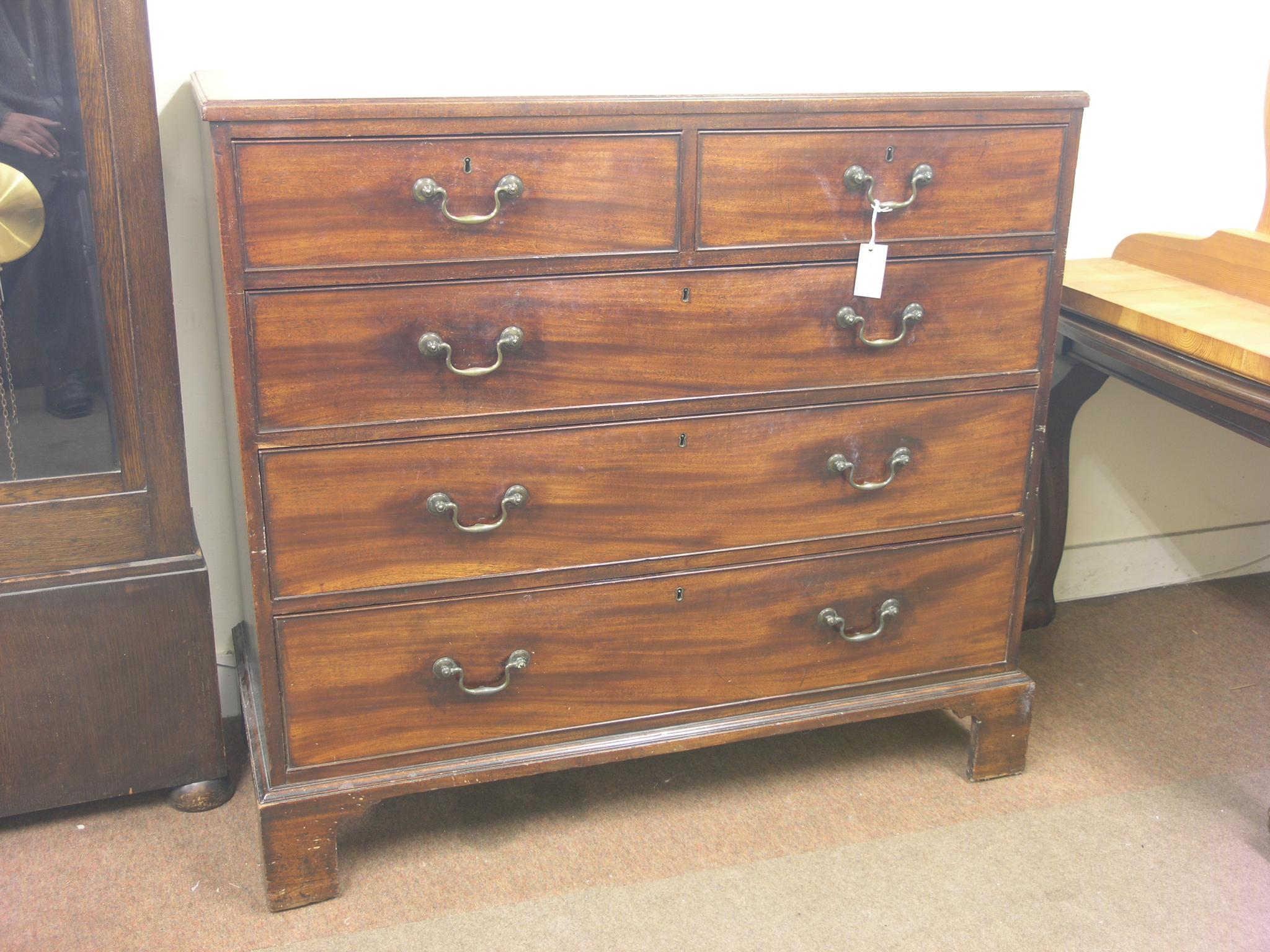 Appraisal: A late George III mahogany chest two short and three