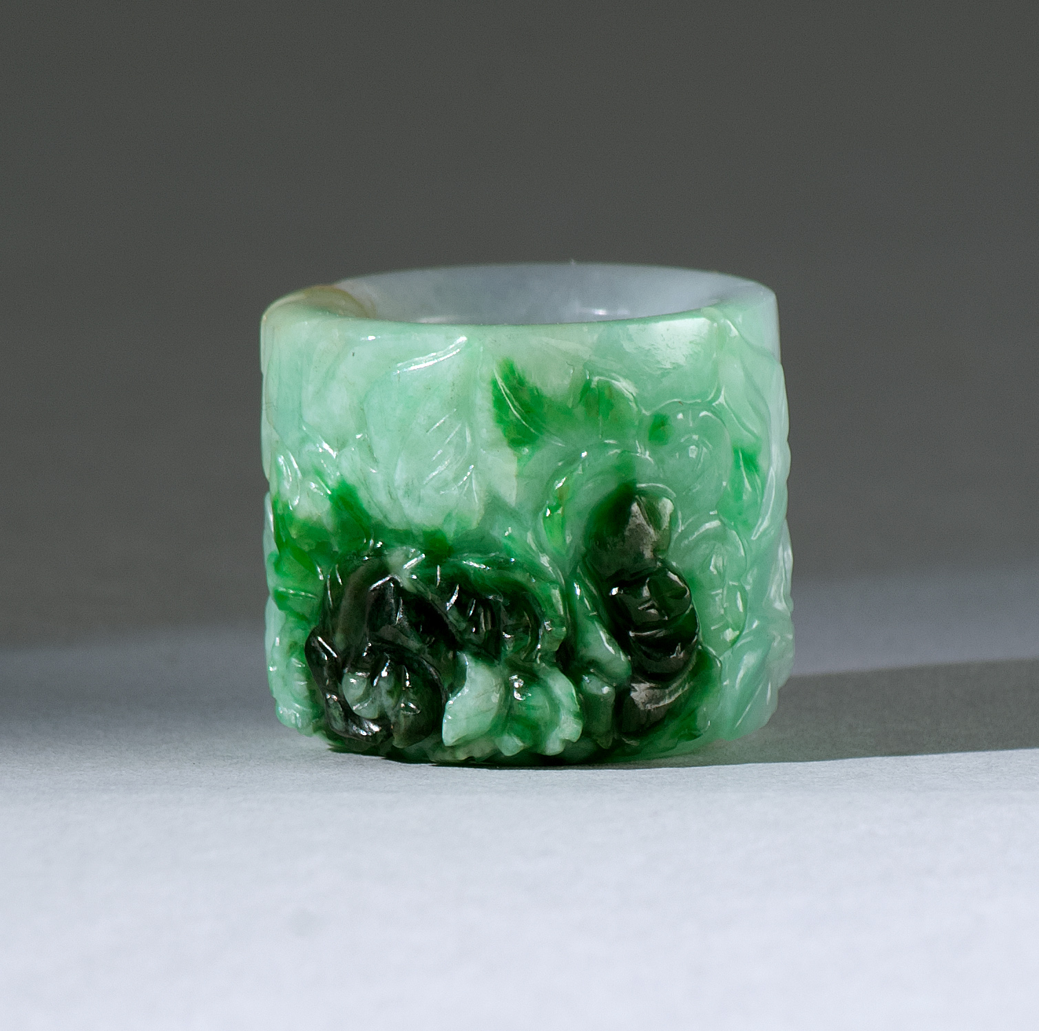 Appraisal: FEI-T'SUI JADE ARCHER'S RING Circa With allover carved flower and