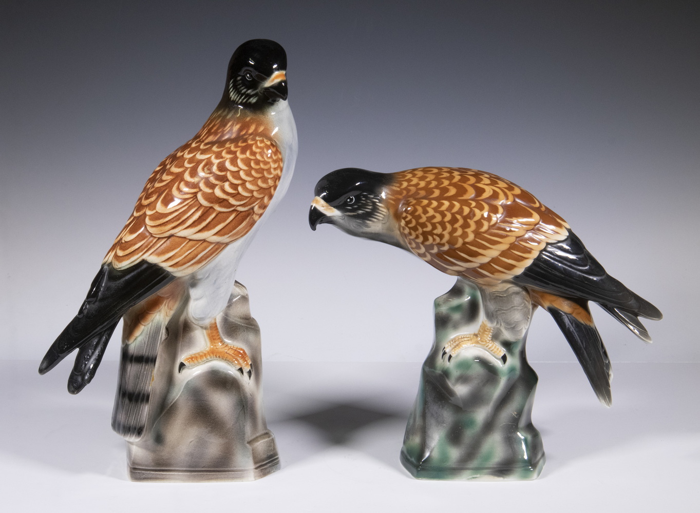 Appraisal: PR CERAMIC HAWK FIGURINES Matched Pair of European Glazed Pottery