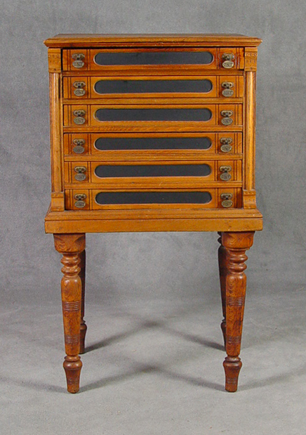 Appraisal: Golden Oak Spool Cabinet on Turned Legs Circa Six drawer