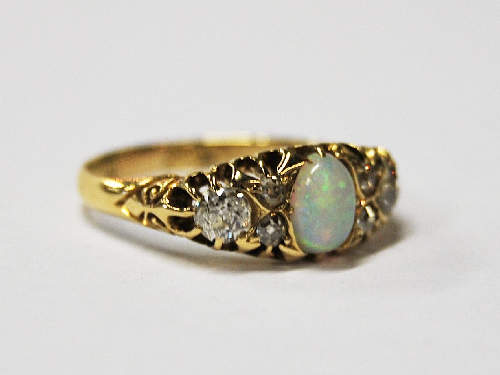 Appraisal: Antique opal and diamond seven stone ring ct yellow gold