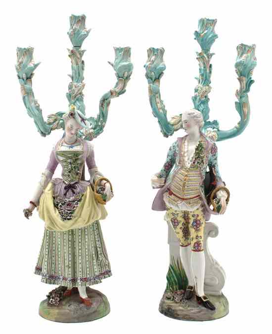 Appraisal: A Pair of French Porcelain Figural Candelabra Montrevic each with