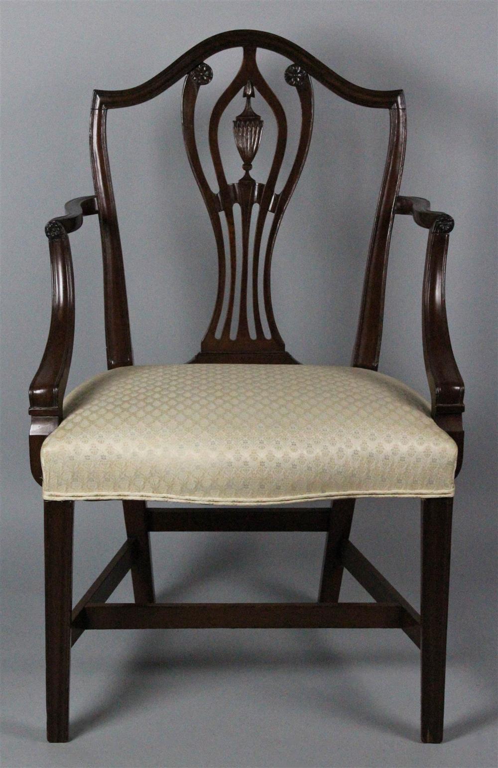 Appraisal: HEPPLEWHITE CARVED MAHOGANY OPEN ARM CHAIR having an arched crest