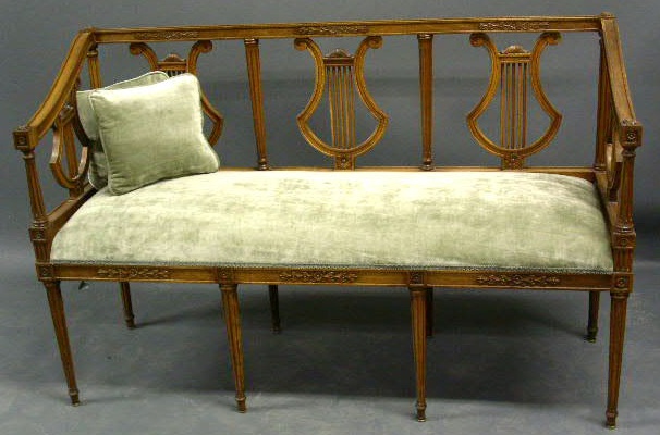 Appraisal: Walnut lyre-form music settee h x w x d seat