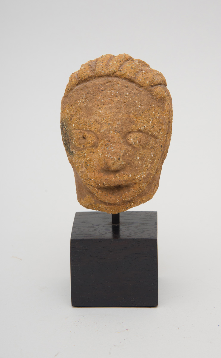 Appraisal: NIGERIAN PRIMITIVE TERRACOTTA HEAD OF A MAN Mounted on a