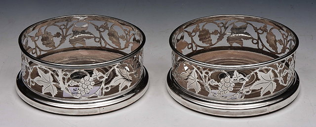 Appraisal: A PAIR OF OLD SHEFFIELD PLATE BOTTLE COASTERS with pierced