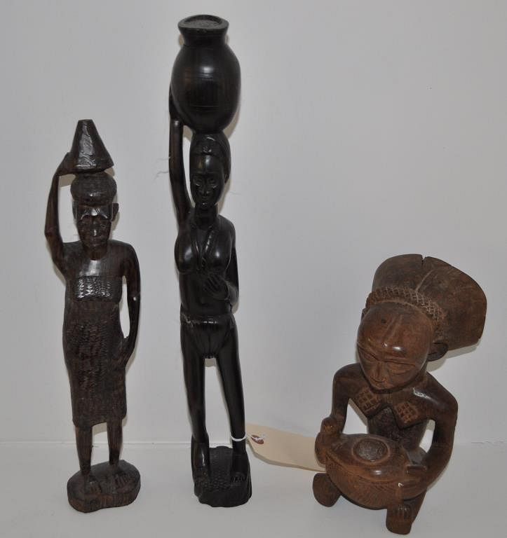 Appraisal: Group Three African Carved Wood Figures Largest high wide