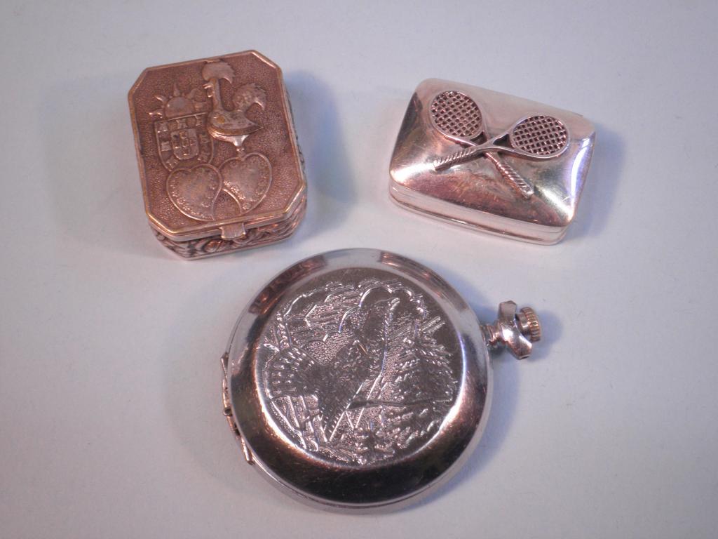 Appraisal: A modern silver pill box decorated with two tennis rackets