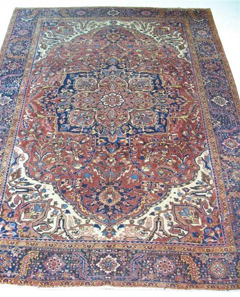 Appraisal: HERIZ RUG The central medallion with a foliate border h