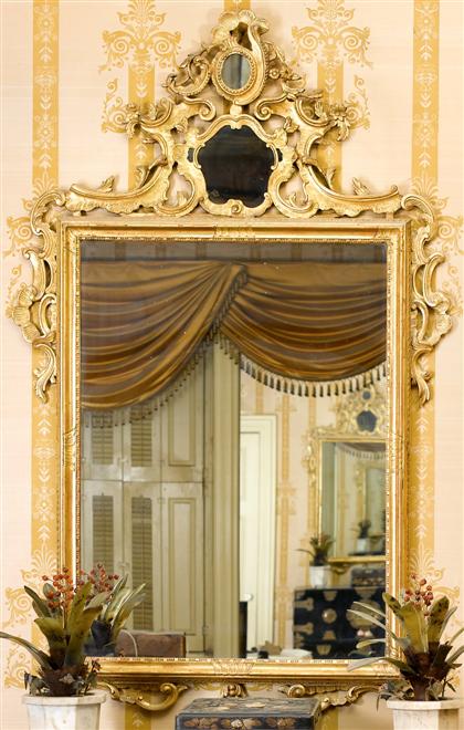 Appraisal: Large Louis XIV style carved and crested giltwood mirrorearly th