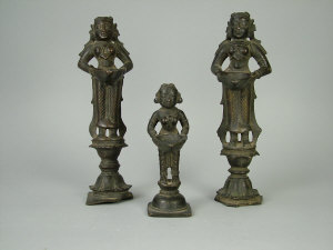 Appraisal: A pair of South Indian figural bronze oil lamps th