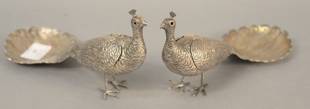 Appraisal: Pair silver peacocks with moveable wings ht lg t oz