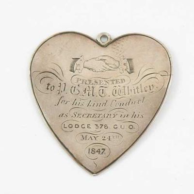 Appraisal: A Victorian heart shaped fraternity badge engraved with a handshake