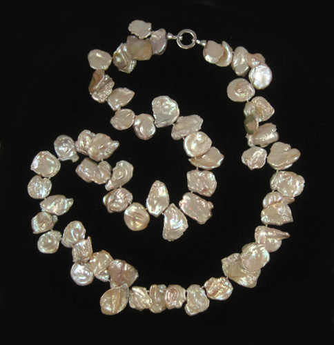 Appraisal: BAROQUE PINK PEARL NECKLACE measuring inches in length and strung