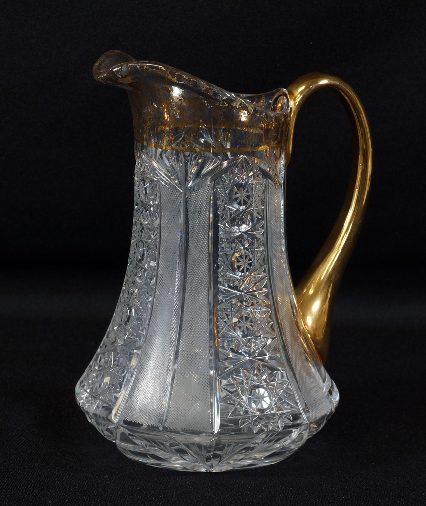 Appraisal: Cut glass pitcher with gilt decorated handle spout star cut