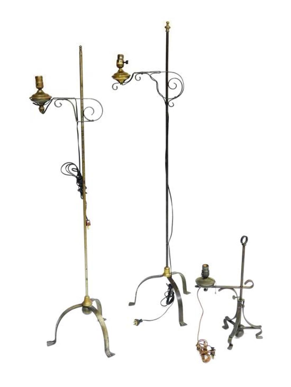 Appraisal: Three similar metal lamps with adjustable scroll arms two floor