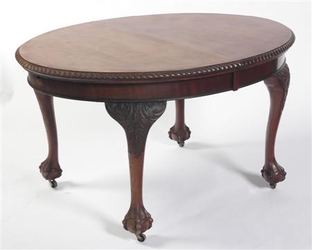 Appraisal: An Edwardian mahogany extending dining table the gadrooned oval top