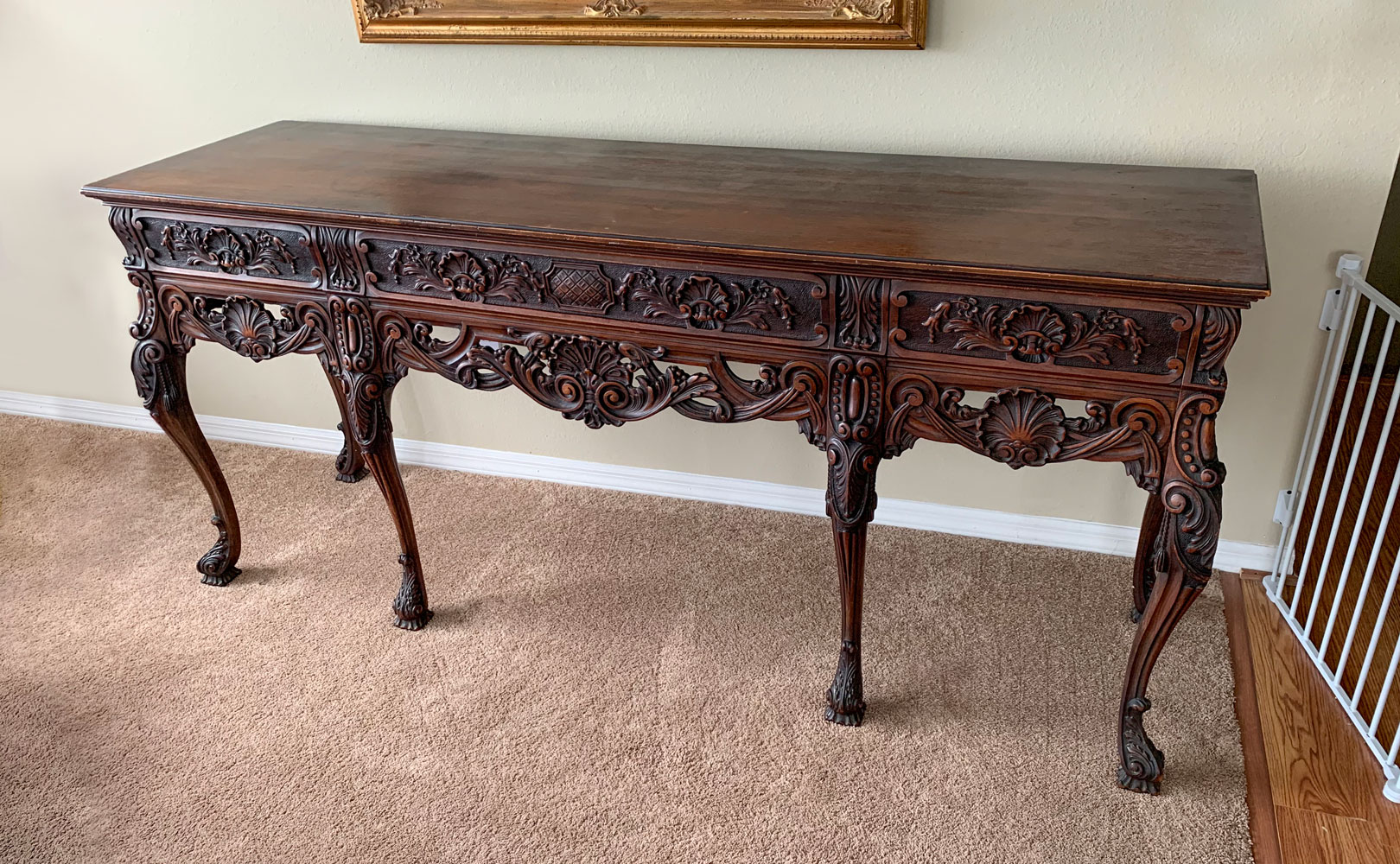 Appraisal: CARVED SIDEBOARD HUNT BOARD Sideboard having an overall Shell medallion