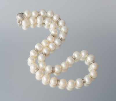 Appraisal: A Cultured Pearl and Diamond Enhancer Necklace Individually knotted approx