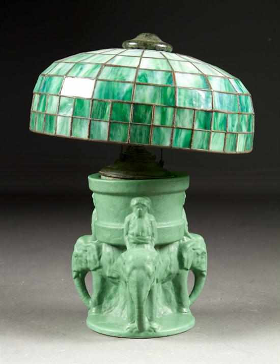 Appraisal: American art pottery figural lamp with leaded glass shade after