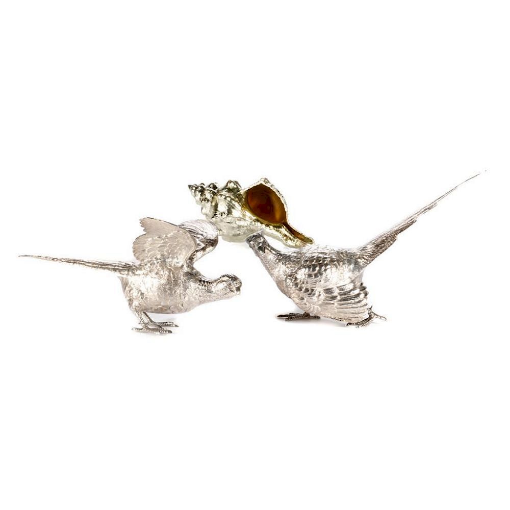 Appraisal: Two silver plate pheasants and a conch shell A pair