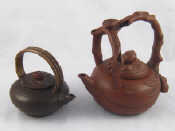 Appraisal: Two Chinese ceramic Yixing style teapots one with lotus fruit