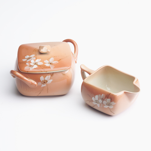 Appraisal: ROOKWOOD Cameo ware creamer and covered sugar bowl painted by