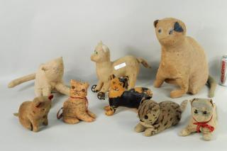 Appraisal: Eight Early Stuffed Cat Toys Eight early stuffed cat toys