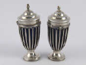 Appraisal: A pair of urn shaped late Victorian silver peppers with