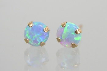 Appraisal: A Pair of Black Opal Gold Ear Studs A pair