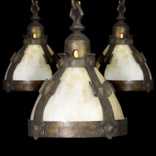 Appraisal: Three Arts Crafts wrought-iron pendant lamps each with four straps