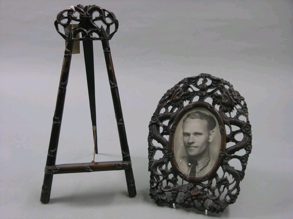 Appraisal: A Chinese carved hardwood easel-type picture stand in together with