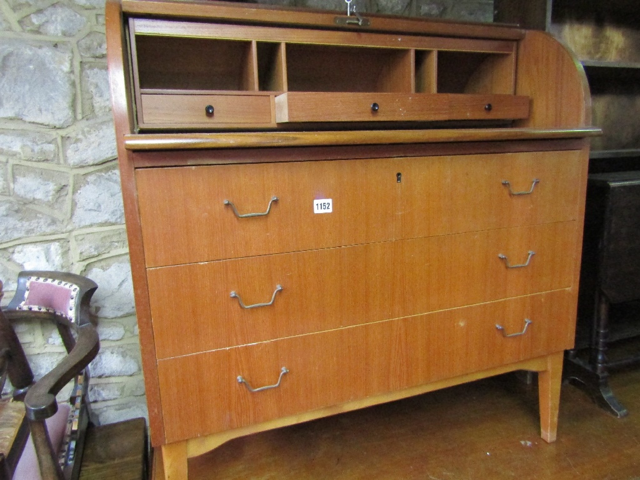 Appraisal: A mid th century teak cylinder top writing bureau with