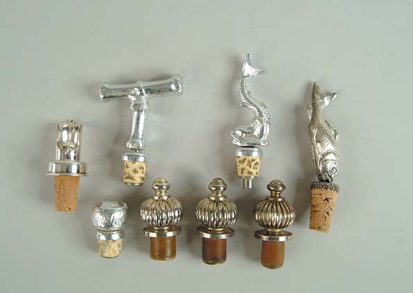 Appraisal: LOT OF EIGHT DECORATIVE FIGURAL STOPPERS Lot includes dolphin fish